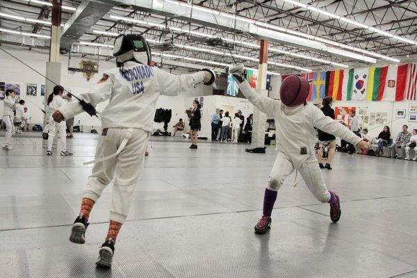 Youth compete at a tournament held at DC Fencers Club in Silver Spring, Maryland.