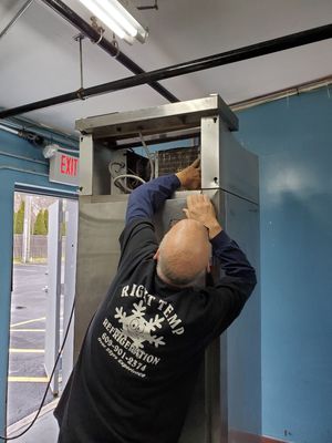 This is the owner working on a freezer