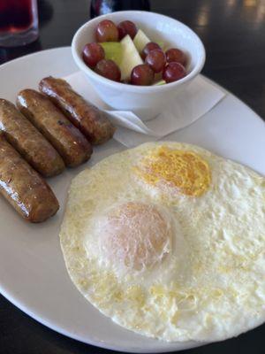 Sausage eggs and fruit.