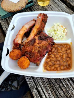 3 rib plate with beans, coleslaw and hush puppy. That 3rd rib is the end and is is really 3 small ribs.