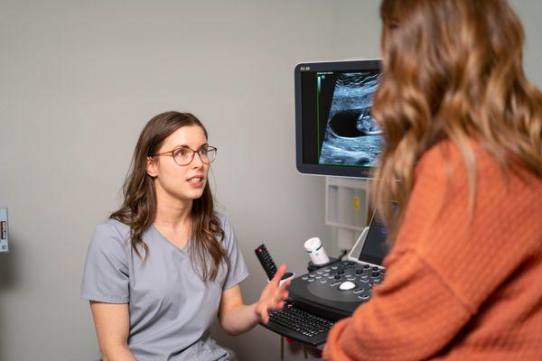 Nurse talking to patient about her ultrasound