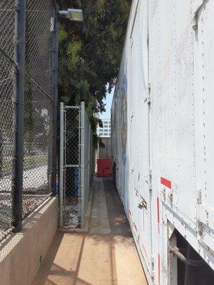 Tight fit: our trailer parking spot is squeezed between the school dumpsters and the baseball field, but TCI makes it fit!