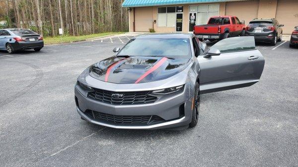 Camaro hood wrap and red Stipes.