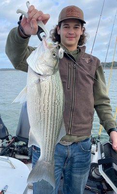 Holding the Line Guide Service client with a Nov. 2022 hybrid from Lake Belton taken on an MAL Lure.