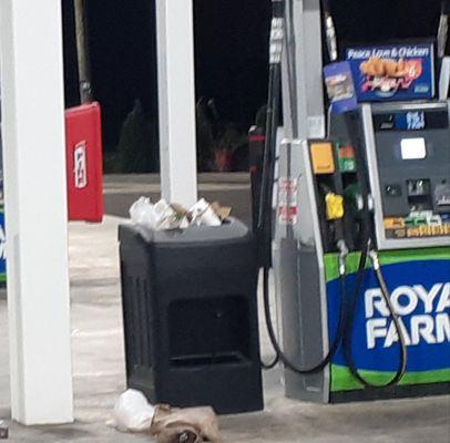 Royal Frams garbage receptacles overflowing at each pump.