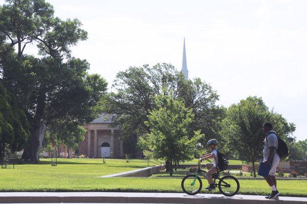 Child riding a bike on the beautiful Boys Ranch campus