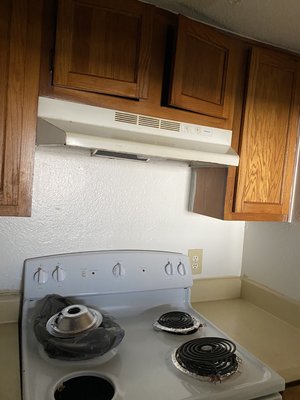 After photo of stove and counters of a move out clean