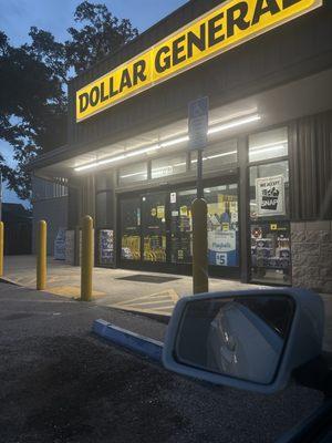 A store that appears to be open but is locked up at 7:21pm on a Thursday. Employees inside but not open for business.