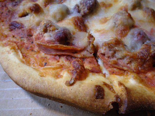 Meat lover's pizza, close-up.