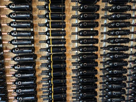 Wine bottles displayed on the wall at Fidelitas.