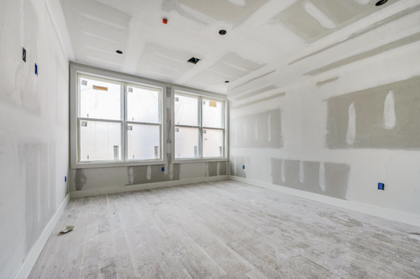 The before photos of a living room in a new constructions four bedroom home.