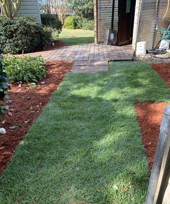 Sod and fresh mulch installation.