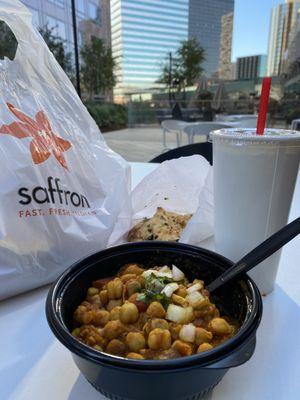 Chana Masala bowl with brown rice and side of garlic naan