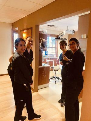 Caught on camera! Hygienist, Jackie, Diane, Kelly and Candi in  "Morning Huddle" planning out patient care for the day!