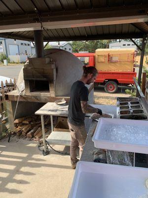 The master pizza chef! Check out that wood burning pizza oven!