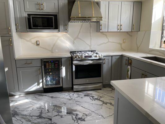 Our custom designed stainless steel abs brass range hood hangs as a centerpiece in our kitchen!