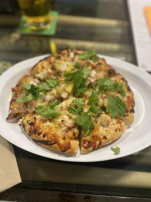 Mini Thai Chicken Pizza flavorful Thai peanut sauce, chicken, crispy cashews, fresh mozzarella cheese, red onions, pineapple and cilantro.