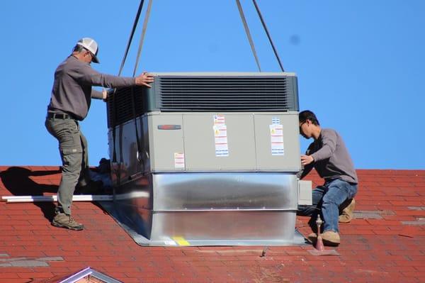 The owner,  Dave Hamel,  setting a new Trane rooftop unit.  Downdraft