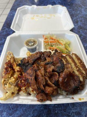 Deluxe Combo with Pork Teriyaki, Calamari, and Sesame Chicken