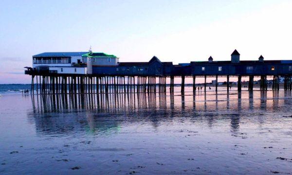 The pier at Old Orchard Beach, Maine at Sunset. (C) 2019 - Present Maine Hospitality Management LLC All Rights Reserved