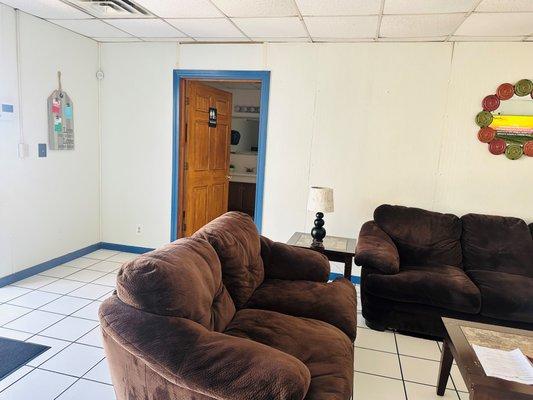 Waiting Living Area with calm atmosphere, TV, & restroom.