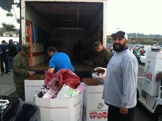 Helping load trucks with Toys for Toys for Tots at Chargers game.