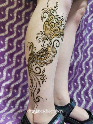 This large peacock on the lower leg is an impressive henna design that will turn heads.