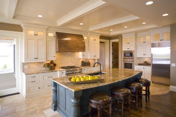 Notice the hand-brushed glaze treatment on the blue kitchen island.