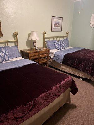 Two queen beds with walk in shower.