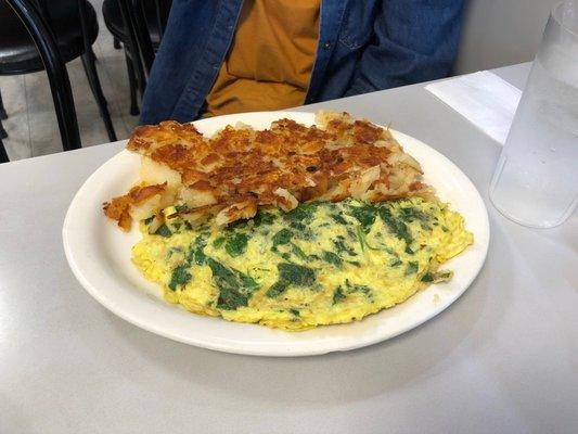 Spinach omelet with home fries.