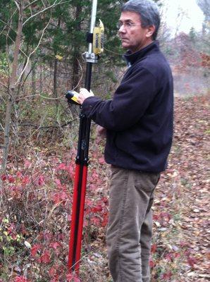 Steve Koerber, licensed land surveyor from Arrow Land Survey company marking hunting land boundaries.