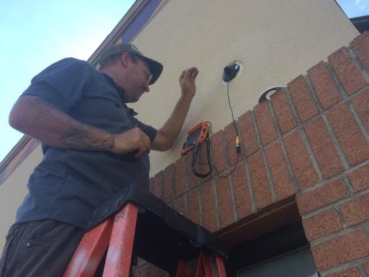 Tim is one of our highly trained and skilled technicians! Seen here upgrading and focusing an outdated low resolution camera ...