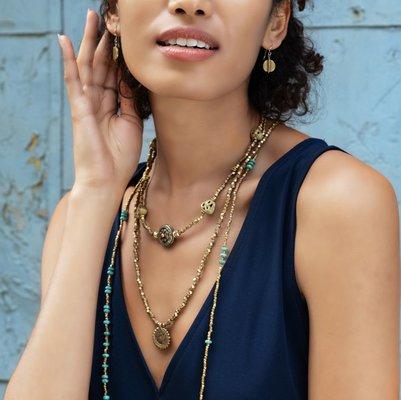 SASKIA pieces look best when they're layered- like this combo of the Sundar, Nepal Medallion, and Funky PK necklaces with Discus earrings.