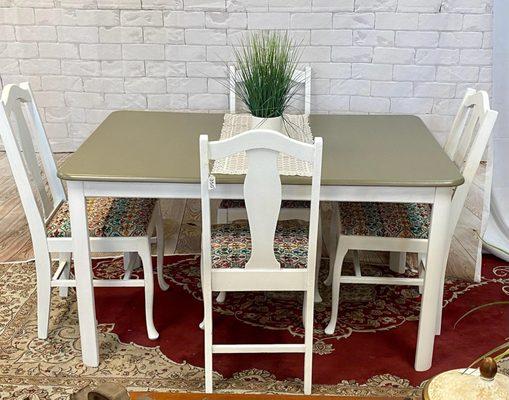 Classic table that has been restored to perfection. Reupholstered chairs with gorgeous material. Extra leaf attached for more seating.