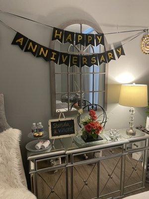 Chocolates, water, fresh flowers and Anniversary banner! So sweet and so much attention to detail