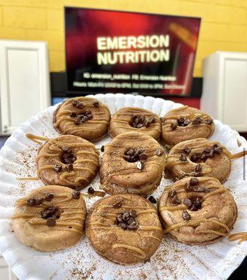 Dulce de Leche protein donuts topped with caramel drizzle, dark chocolate, and cinnamon