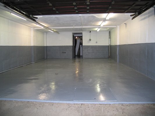 Painted walls and ceiling with white and gray. Painted garage floor with epoxy paint