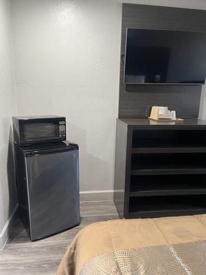 Microwave, mini fridge and TV in rooms