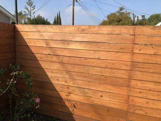 Refinish wood fence