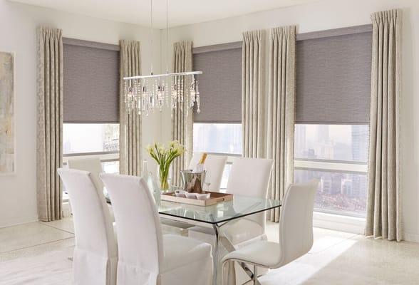 Roller shades in "strings blackout slate" pattern with a cassette valance and inverted pleat side drapery panels.