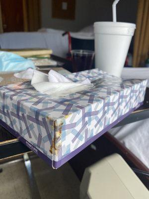 Feces on his tissue box left on his tray in front of him! Gross!