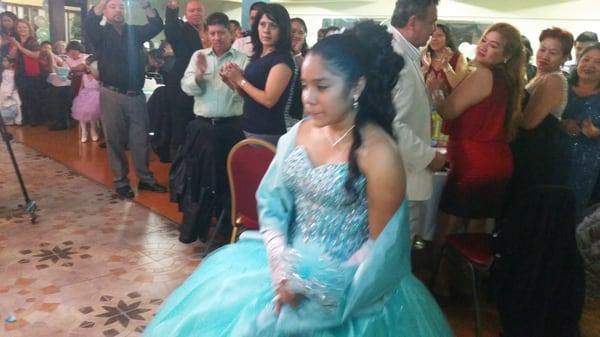 The very happy birthday girl in her quinceanera