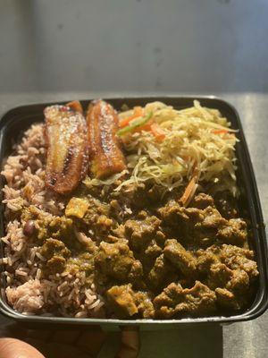 Curry goat with rice and peas