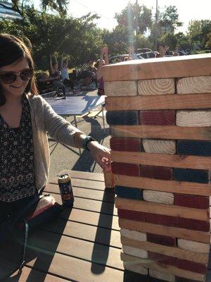 Giant jenga with some yoga in the background