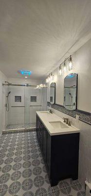 Main Bathroom Renovation including custom shower with marble bench seat and Laura Ashley tile floor.