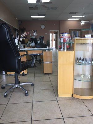 Inside the salon on the nail station side. Pedi chairs are on the other side.