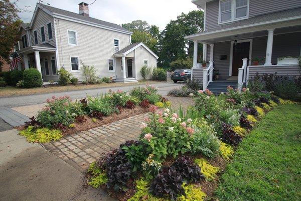 Gardens, paver walkway, paver driveway, patio and custom screen in back yard in Milford, CT