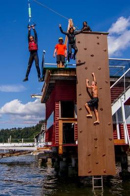 Kids experience a cliff jump, rock climbing wall, ocean zip line, floating mats, and amazing ocean fun & education!