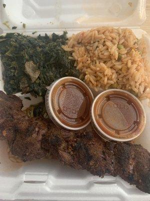 Nigerian kabob, spinach, and jollof rice