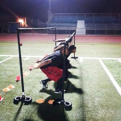 Coach Bobby Hosea Jr Helmet Free Tackling Clinics with PacWarriors Women's WFA Football Team.